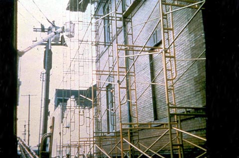 Figure 4. Powerlines being shielded by utility worker.