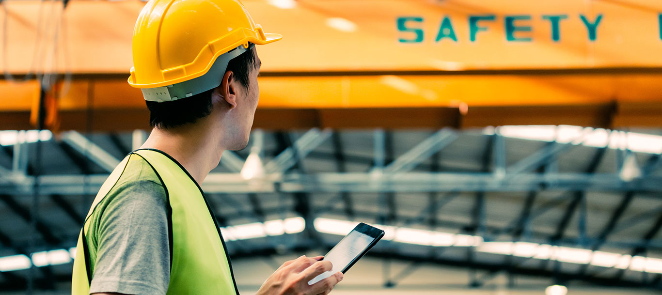 Construction worker checking safety lift