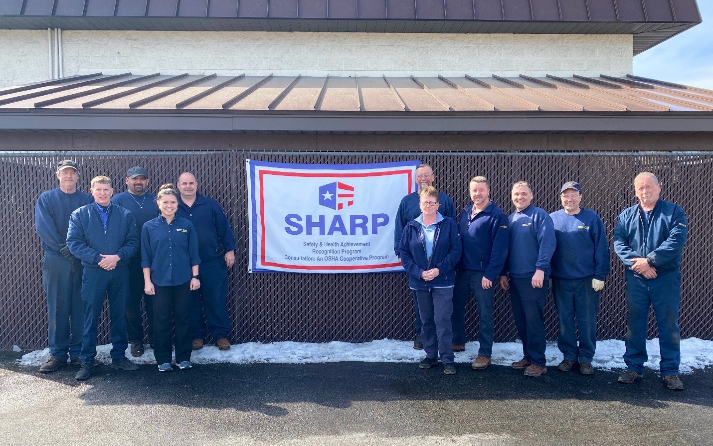 Warren Tire employees proudly celebrate SHARP accomplishment (from left to right): Dan Mulcahy, Chris Skogsberg, Bob Kellogg, Megan Kellog, Glen Wetherby, Rae Butler, Chad Sucese, Dan Mallory, Randy Facto, Scott Danahy, and Steve Larose.