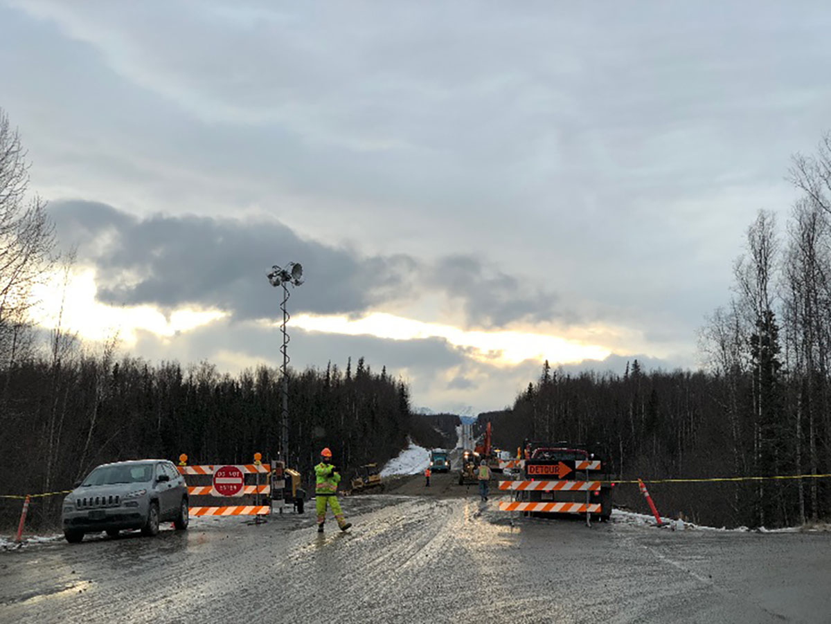 Roadwork being performed on Vine Road in Wasilla. This section of road was heavily damaged, including utility lines running parallel to the road. Repairs are being done safely.