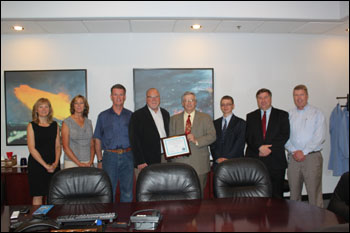 Presentation of SHARP certification at EE Technologies, Inc. From left to right, Karla Osorno - Business Development, Laura Anderson - Human Resource Supervisor, Rick Pink - Facilities Team Lead/Safety Manager, Sonny Newman - President, Don Jayne - Administrator of Division of Industrial Relations (at the time of the photo), John Lindgren - Safety Representative from SCATS, Andy Giddings - Consultation Supervisor from SCATS, and Clay McElhany - Director of Operations.