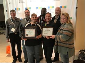 Malco Safety Committee Members with their MNSHARP Certificate and the Minnesota Safety Council, Governor’s Safety Award  Front Row, Left to Right: Robbin Bauer, David Stueve, Sarah Zipoy Back Row, Left to Right: Chris Strand, Brandon Moeller, Abdoulie Jagne, Todd Gunnerson