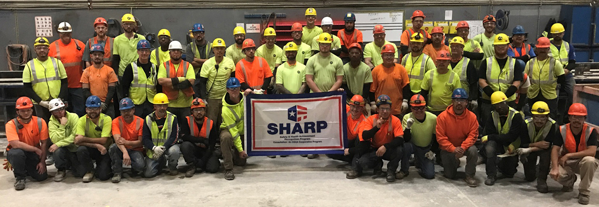 Mid-States Concrete Industries Team Accepting Their OSHA SHARP Flag