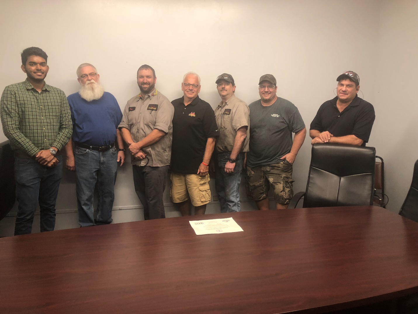 Phoenix Sintered Safety Committee with the SHARP Certificate and the Governor's Letter on the Table  Left to Right-Sundervel Velayutham, Operational Excellence Coordinator,Steve Anderson, 2nd Shift Supervisor, Josh Crawford, Maintenance Manager, Terry Fustine, Safety Coordinator, Ron Perkins, Die Setter, Brad Smith, Manufacturing Engineer, Steve Cappetta, Tool Shop Manager.