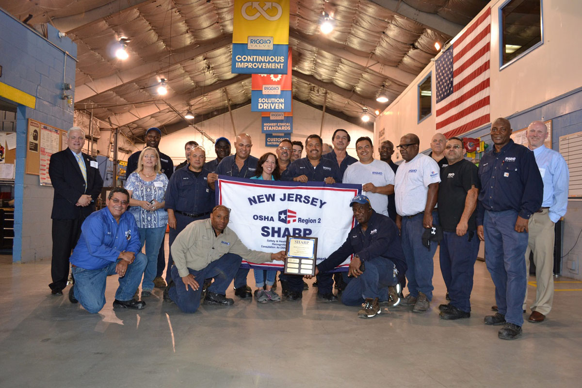 Frank D. Riggio Co Inc., Team Accepts OSHA SHARP Award and Flag (Scott Lingle, April Morweiserm, Lise Hansen, Chris Grant, Davis Mancia, Scott Irslinger, Seymour Brown, Victor Herrera, Hector Jaramillo, Carlos Rodriquez, Alfonso Lenis, Gus Camacho, Burke Lalor, Vin Riggio, Charlie Caputo, Gerardo Bedoy, Tony Reeves, Erol McCook, Rafael Ross, Wayne Manderson, Ted Slowley)