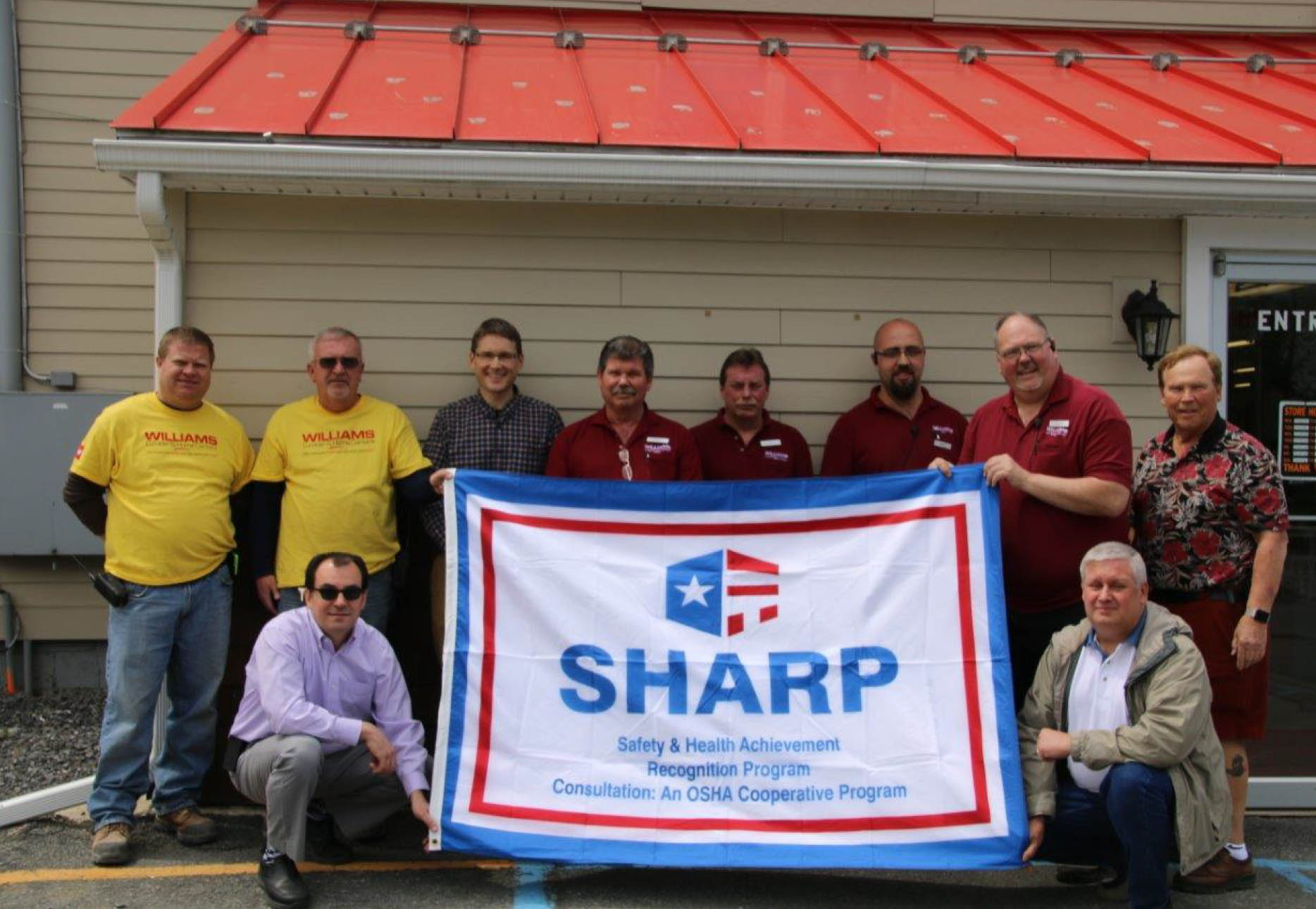 Williams Lumber & Home Centers Team Celebrates Earning SHARP Recognition  (Left to Right: T.J. Keeler, Kevin Blair, Jim Cataquet (kneeling), Tom Jozefowicz, Gary Strompf, Darryl Muller, Mike Staccio, Rich Fitzgerald, Geoff Holodook (kneeling), Sandy Williams)