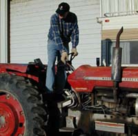 Never stand atop a tractor