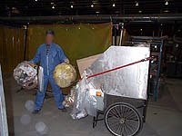 Figure 36: Worker removing trash from work area.