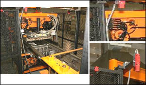 Figure 15. Trim Station guarded by fixed barriers and interlocked gates to prevent access to knife blades or moving machinery.