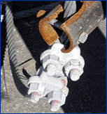 Image of a strut secured to cable.