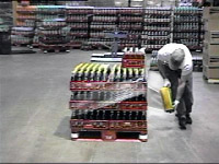 Figure 11: Employee wrapping pallet.