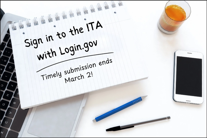 Notepad with "Sign in to the ITA with Login.gov - Timely submission ends March 2!" written on it