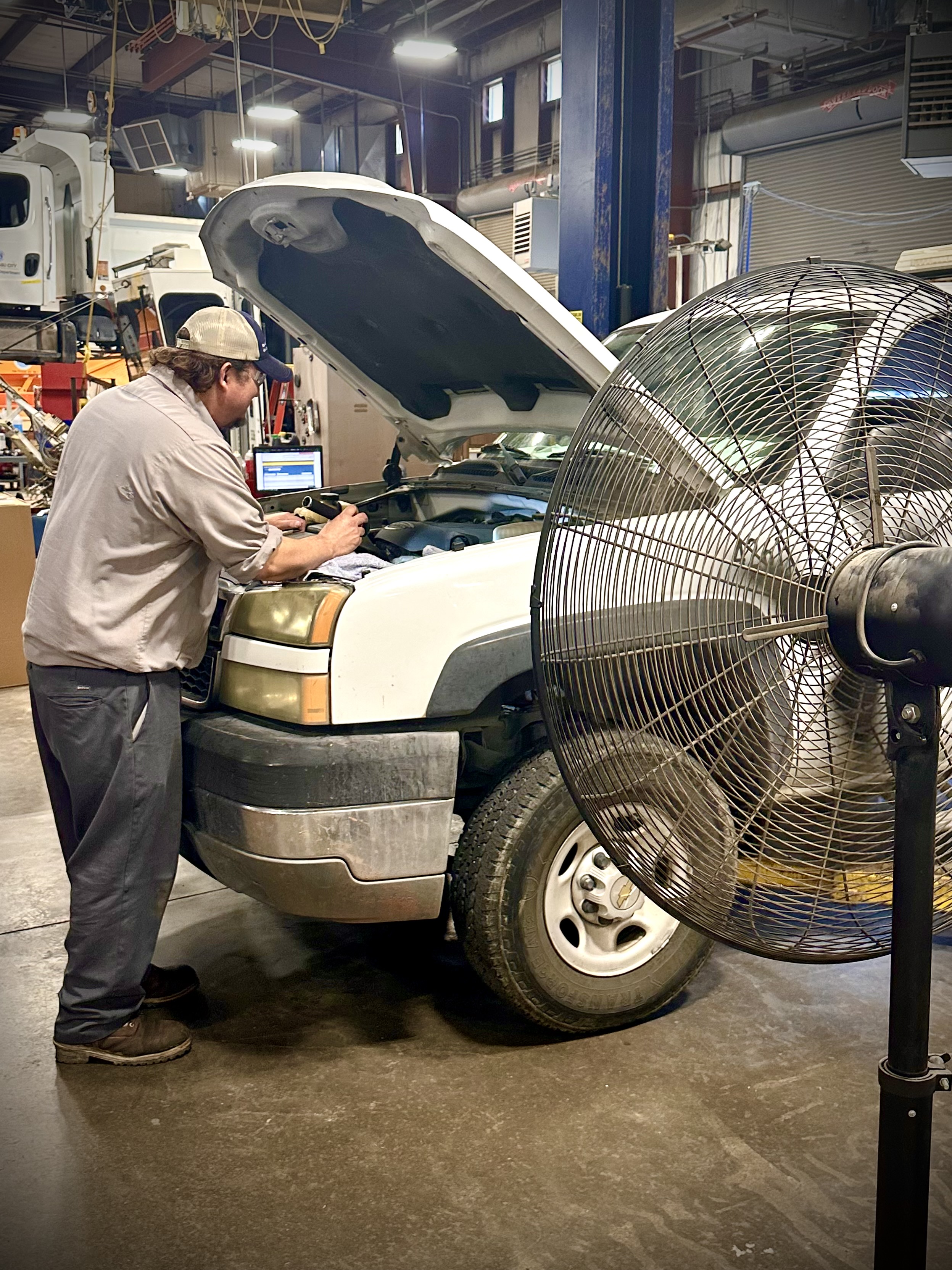 Lake Havasu City of Arizona : Lake Havasu City in Arizona depicts a mechanic working on a vehicle on a hot day