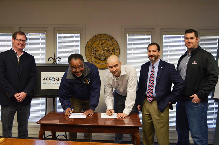 Photo Credit: OSHA| Copyright: Public Domain | The U.S. Department of Labor Occupational Safety and Health Administration's Little Rock Area Office and the Arkansas Chapter of the Associated General Contractors of America renewed a strategic partnership Feb. 4. (From Left to right) Thomas Dickinson, AGC vice president and treasurer; Carlos Reynolds, OSHA's Little Rock Area Office director; Joe Morgan, AGC safety director; William Fletcher, AGC president; and Lance Wright, AGC field representative.)