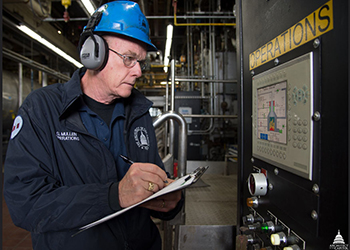 Worker checking noise levels