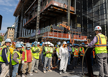 Workers attending a safety stand-down at construction site