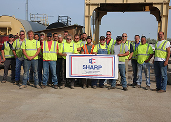 Opp Construction employees pose with SHARP renewal certificate