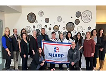 Baptist Retirement Community employees with their SHARP flag.