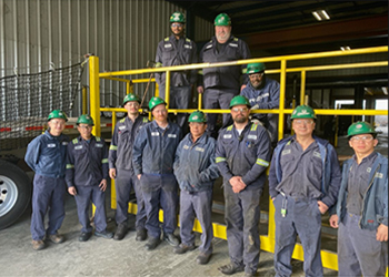 St. Louis Cold Drawn teammates standing with fall protection equipment in the shipping area.