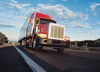 Semi-truck driving on road