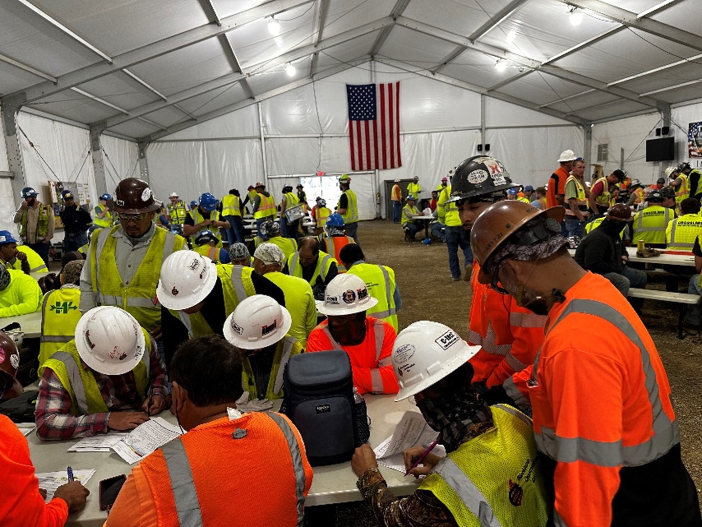 Savage Co : large group of workers taking a break in Savage Co’s large, air-conditioned tents