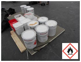 Figure 2: Metal containers of flammable adhesive.