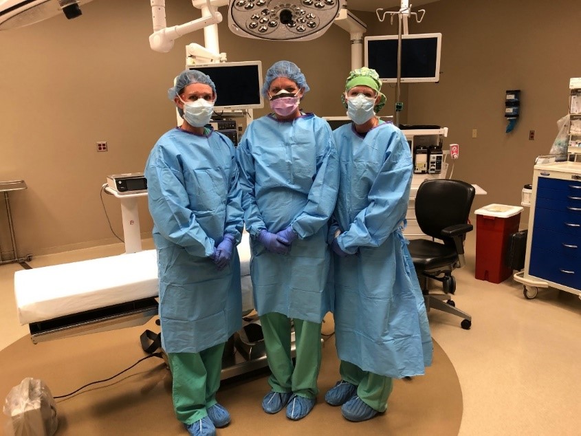 From left: Kayla Jones, RN; Mollie Hiltibrand, RN; and Kay Lyn Mueting, RN and surgery manager, demonstrate proper PPE attire for surgery during the pandemic